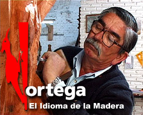 Título de la página: Ortega el idioma de la madera. Imagen del Escultor Juan carlos Ortega tallando una pieza en madera 