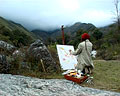 Artista realizando una obra en el Encuentro de pintores paisajistas.